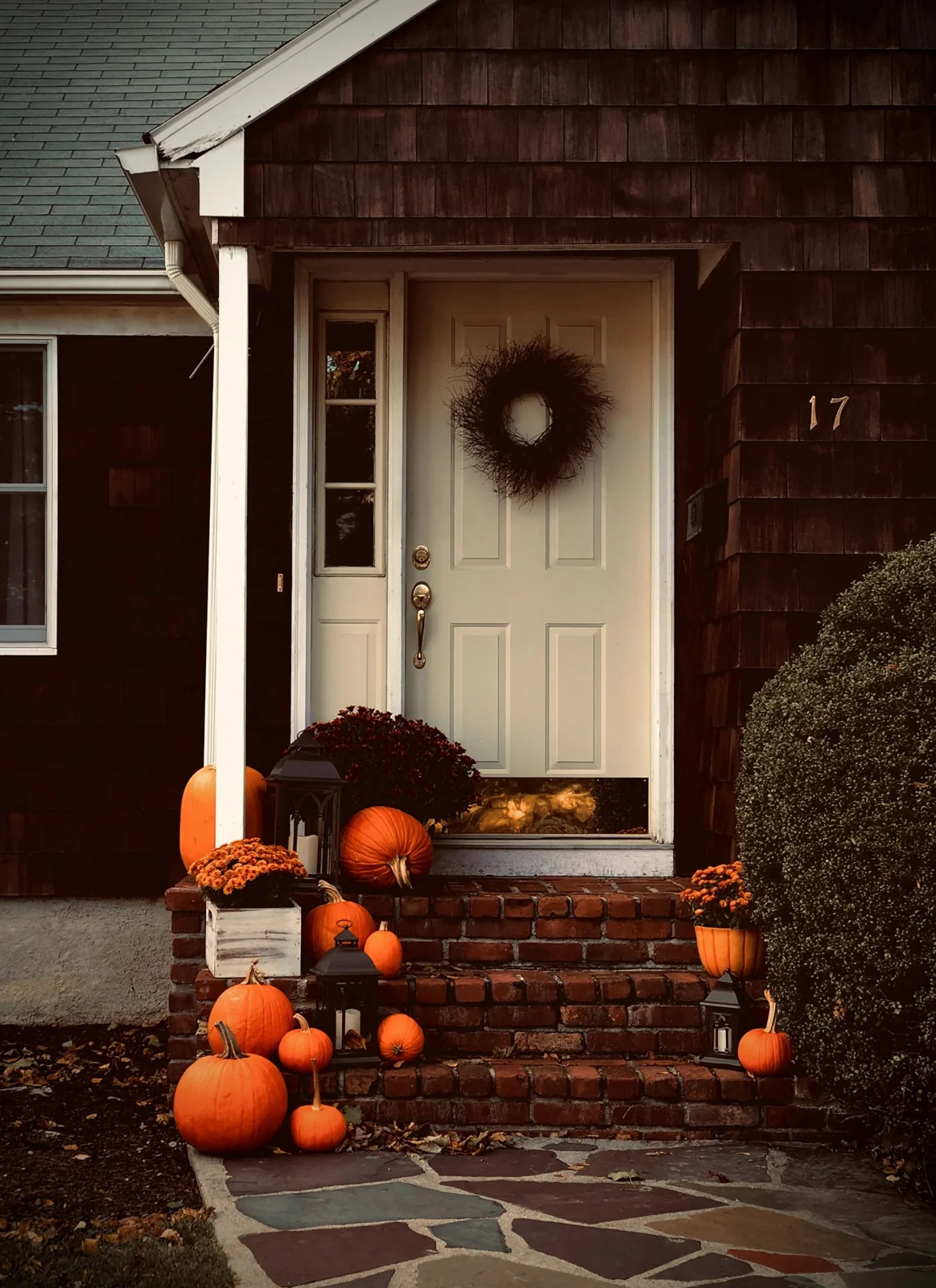 Pumpkins and lanterns on front porch
