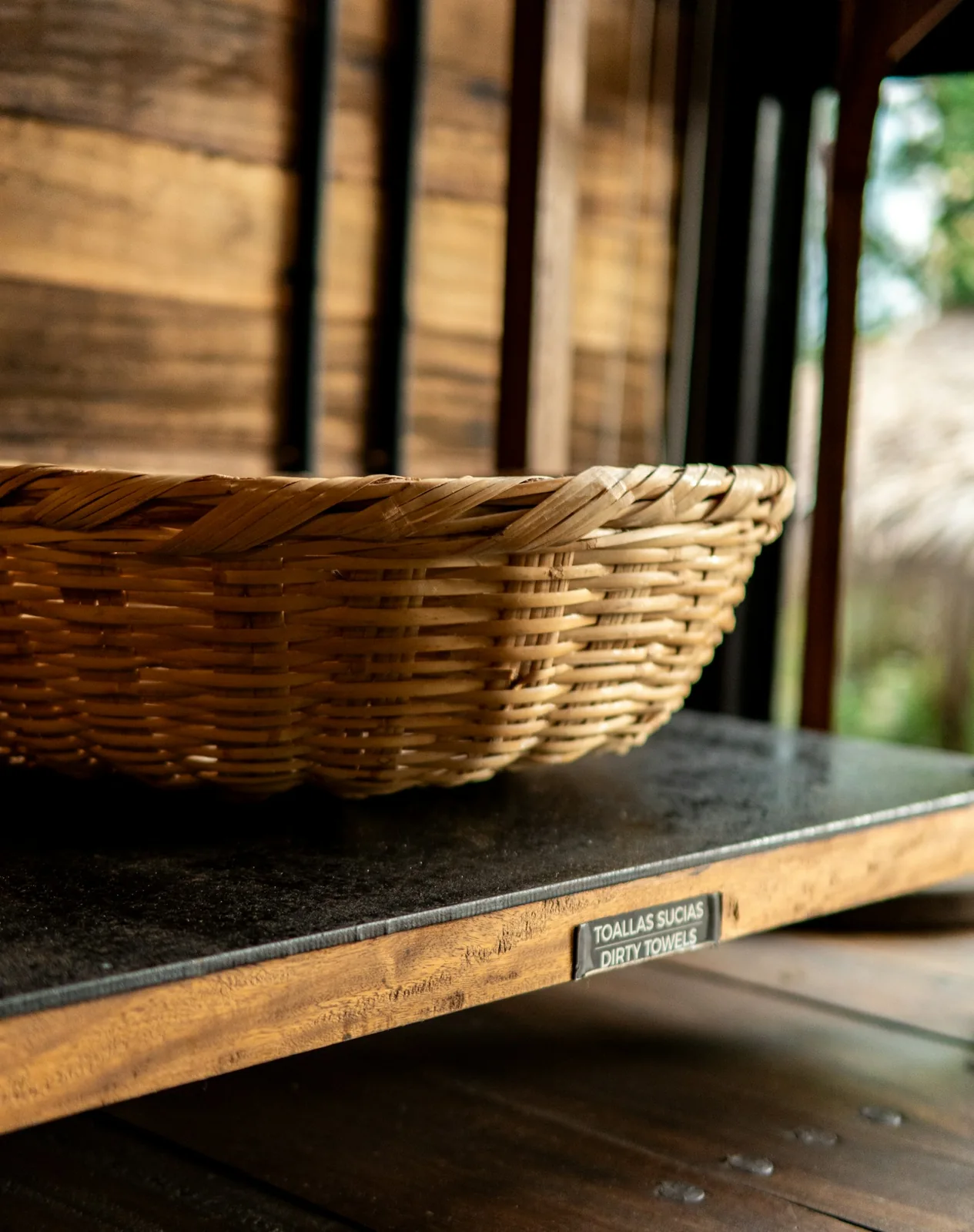 Woven storage basket on wooden shelf