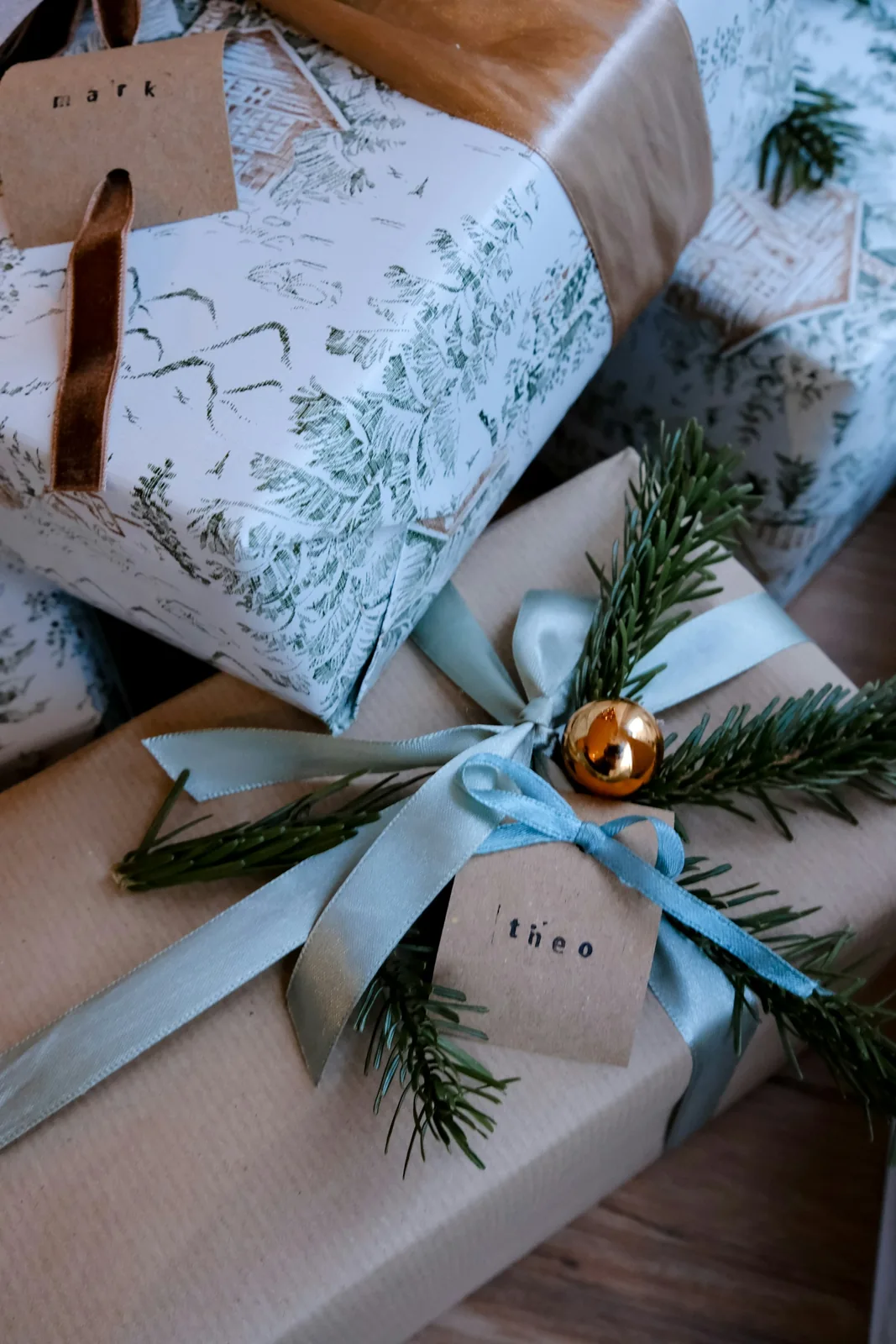 Wrapped gifts with ribbons and name tags