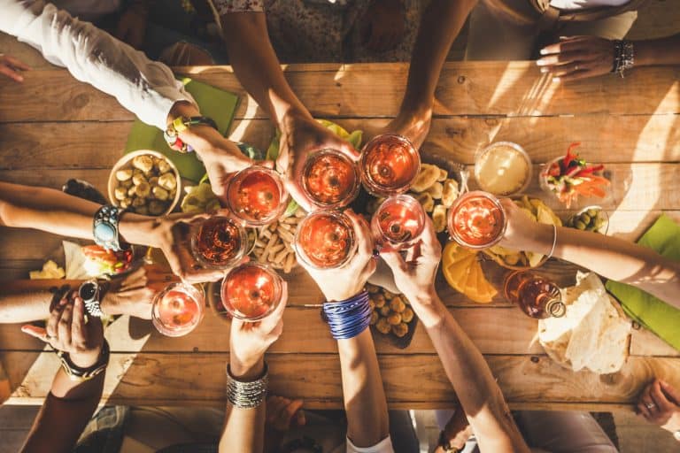 Top view of group of friends clinking and have fun together